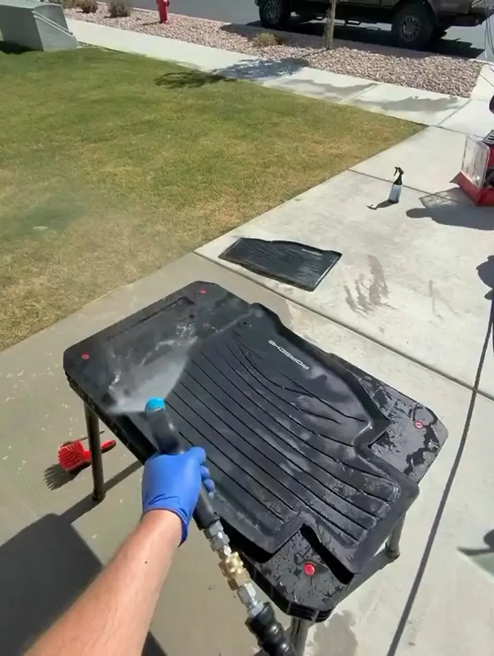 Pressure washing a Porsche floor mat