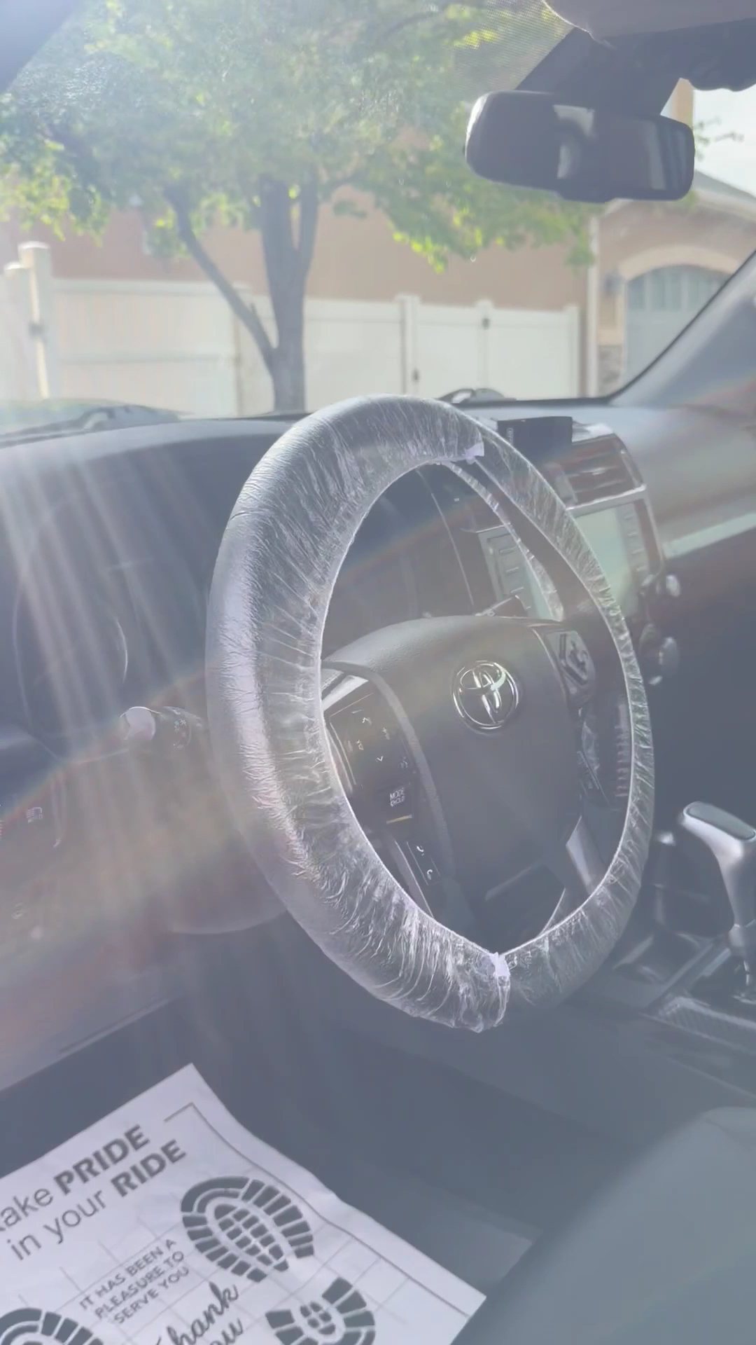 Steering wheel fitted with a protective cover during detailing